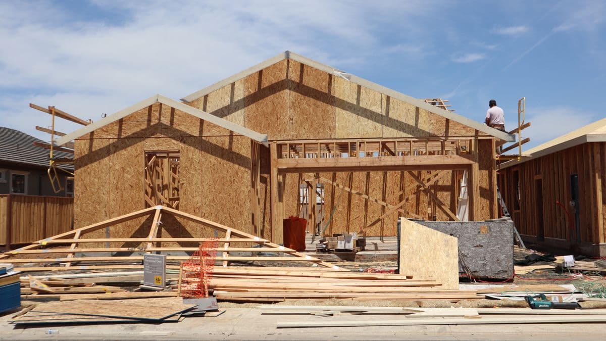 A wood-framed house under construction