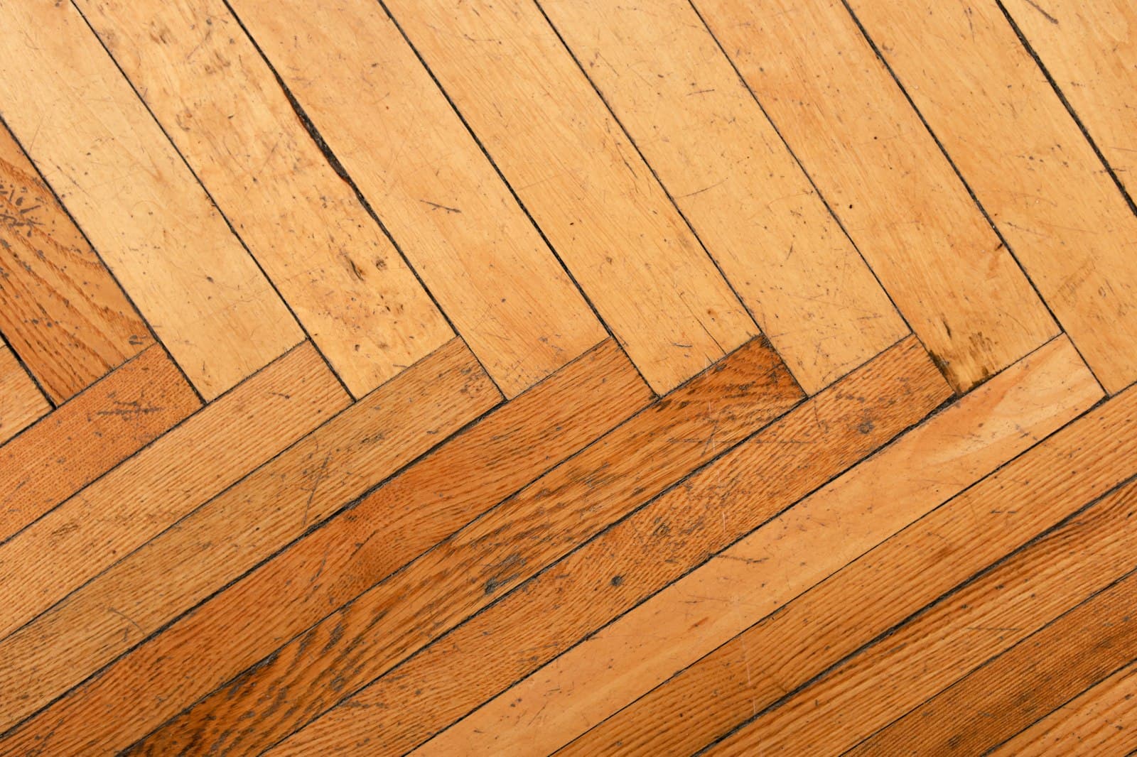 A herringbone hardwood floor